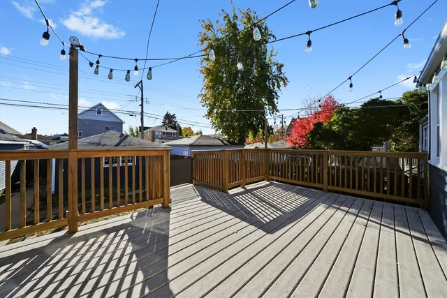 a front view of a house with a garden and a yard