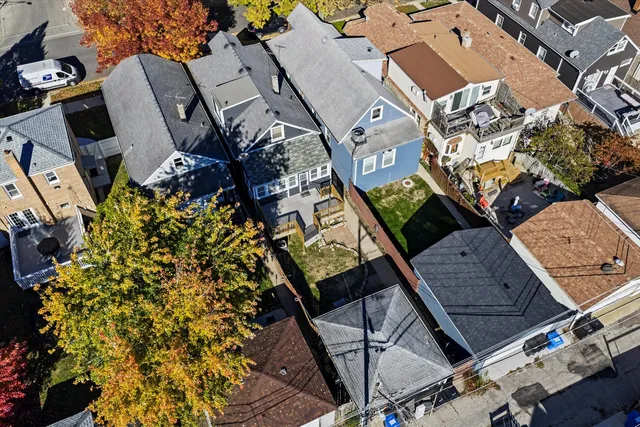 an aerial view of a house with outdoor space