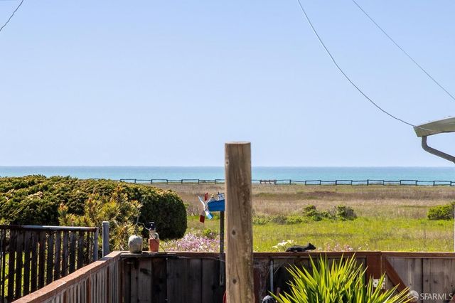 a view of a balcony with lake view and mountain view