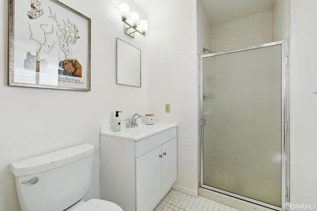 a white toilet sitting next to a bathroom sink