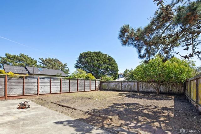 a view of street with a backyard