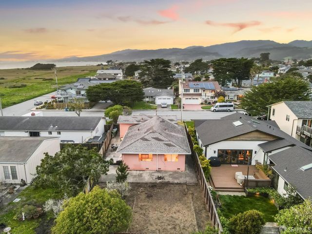 an aerial view of a house with a garden