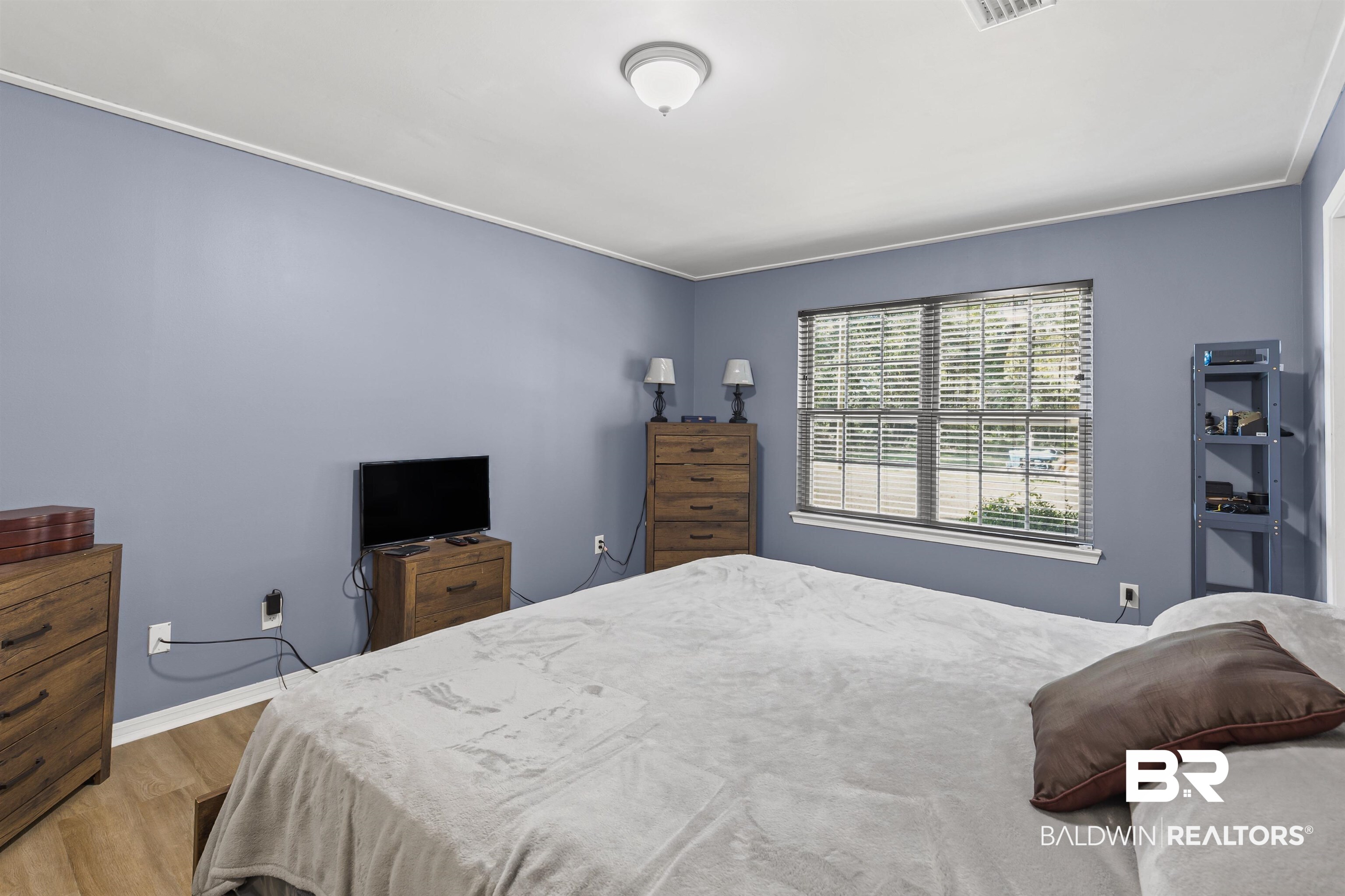 8911 Owassa Road Evergreen, AL 36401 - Photo 12 of 24 Bedroom with wood finished floors and crown molding