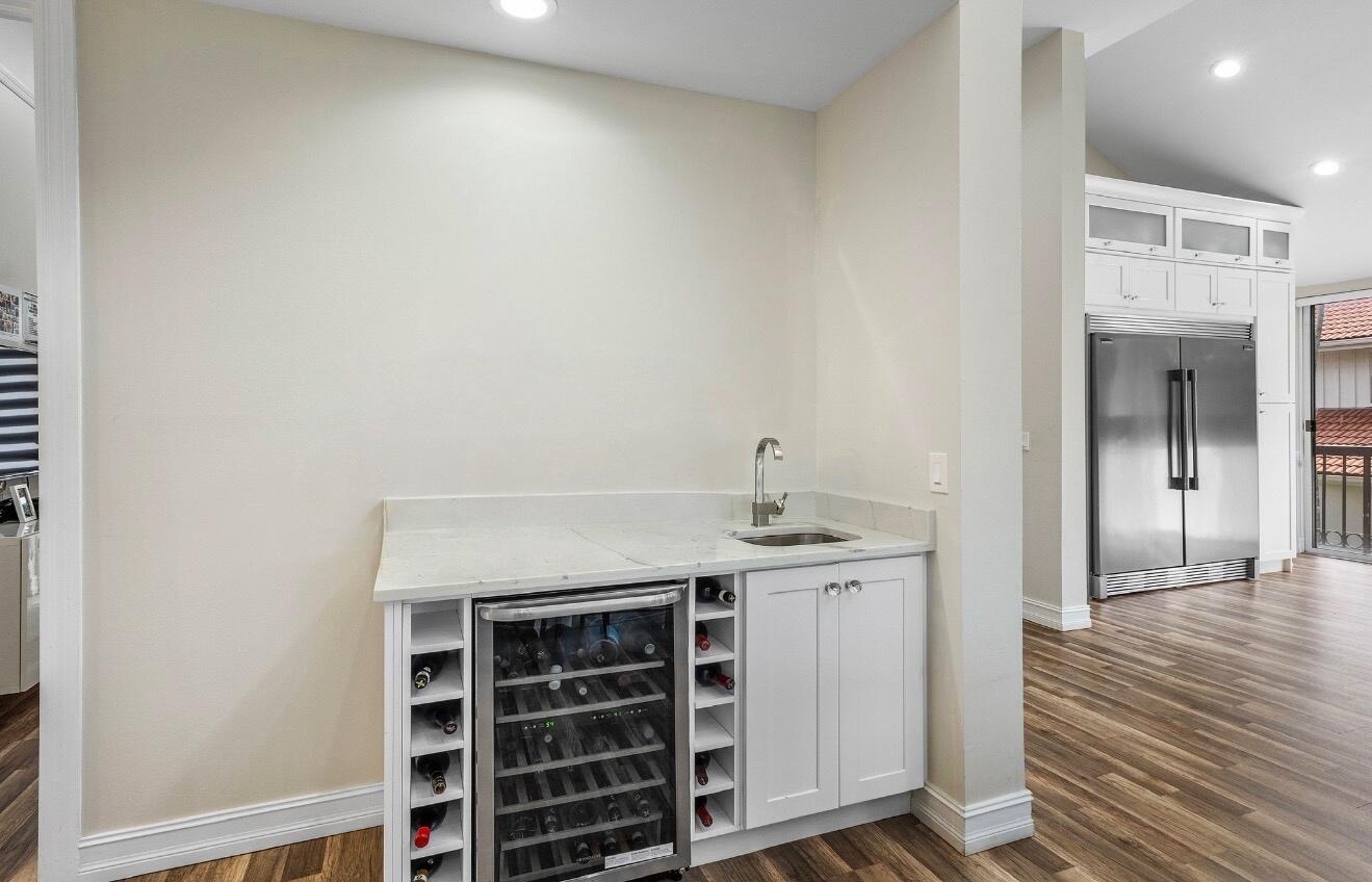 5887 Northwest 24th Avenue, Unit 1203 Boca Raton, FL 33496 - Photo 14 of 62 a view of kitchen and wooden floor