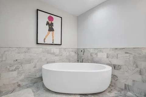 a bedroom with a bed and a table