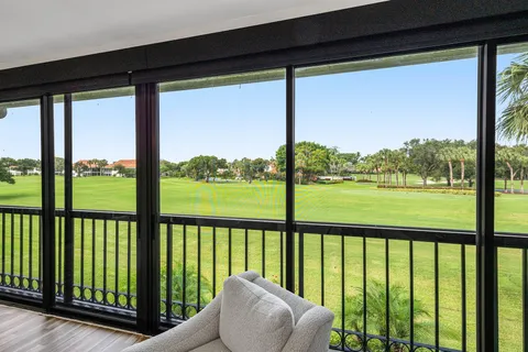 a view of a pathway with flower plants