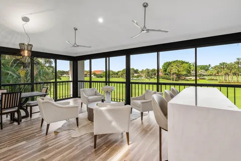 a view of a house with potted plants