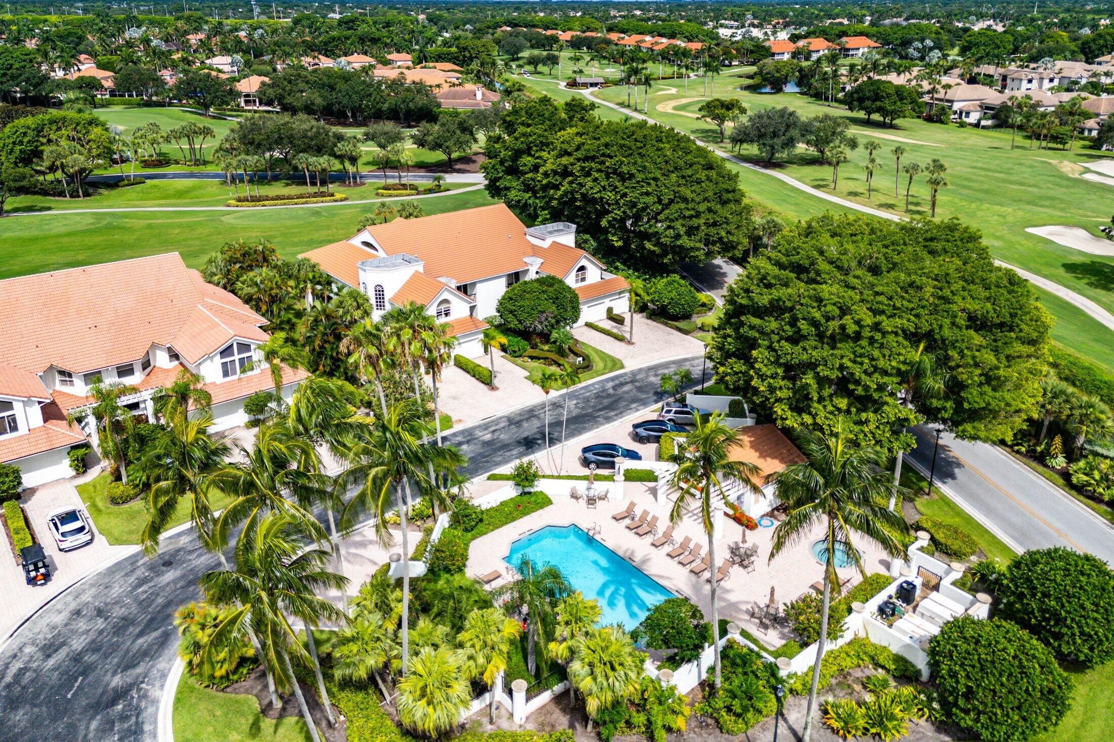 5887 Northwest 24th Avenue, Unit 1203 Boca Raton, FL 33496 - Photo 38 of 62 a view of a garden with a lake
