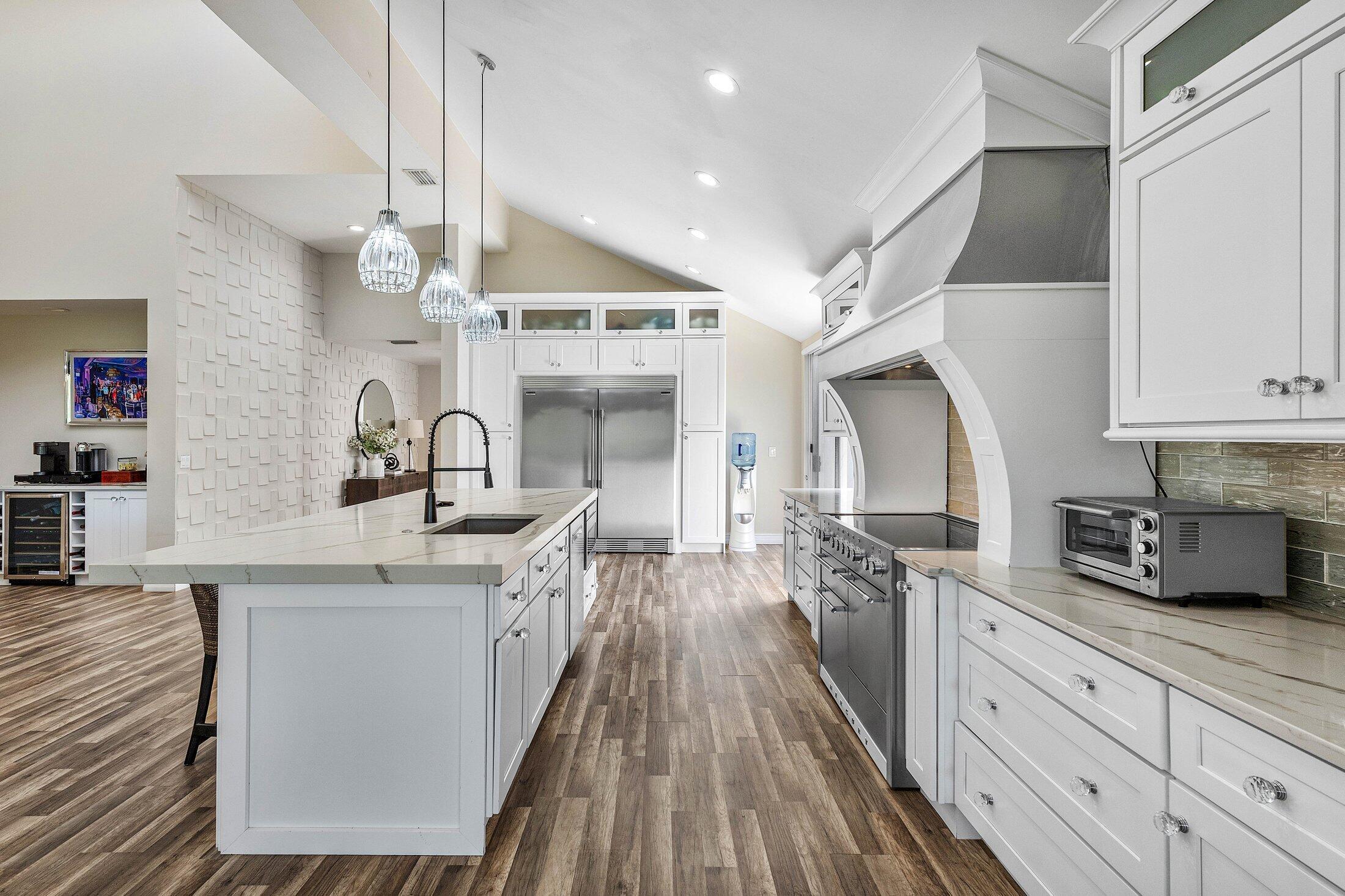 5887 Northwest 24th Avenue, Unit 1203 Boca Raton, FL 33496 - Photo 6 of 62 a kitchen with cabinets a sink and appliances