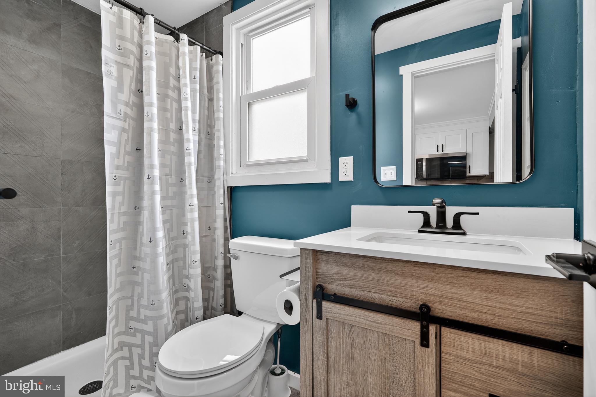 223 Noreg Place Brooklawn, NJ 08030 - Photo 20 of 36 a bathroom with a granite countertop sink vanity mirror and toilet
