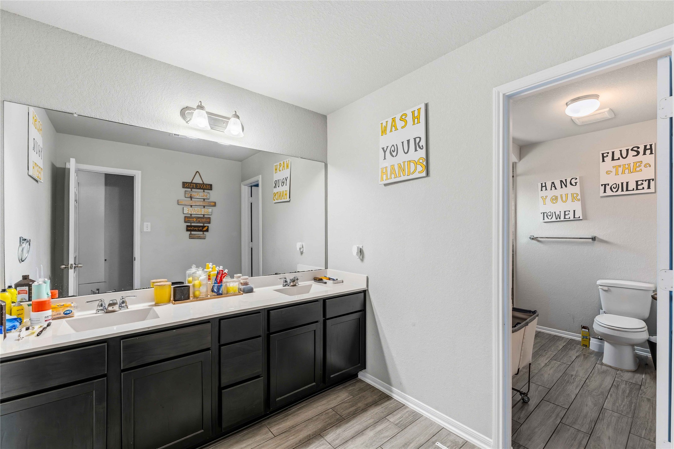 14810 Ruddy Duck Lane Houston, TX 77049 - Photo 23 of 33 a bathroom with a sink mirror and toilet
