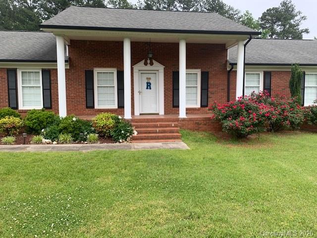 1150 Miles Road Dallas, NC 28034 - Photo 1 of 14 a front view of a house with garden