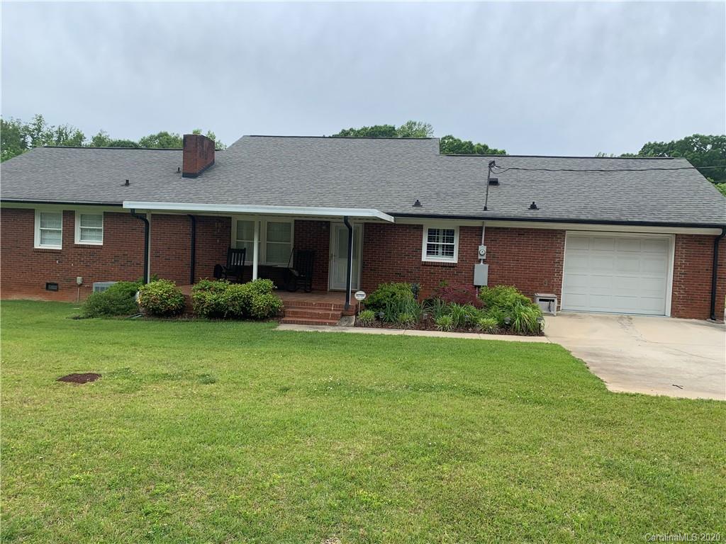 1150 Miles Road Dallas, NC 28034 - Photo 2 of 14 a front view of a house with garden