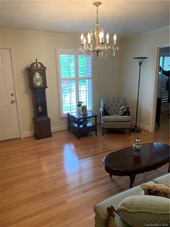 1150 Miles Road Dallas, NC 28034 - Photo 12 of 14 a living room with furniture and a chandelier