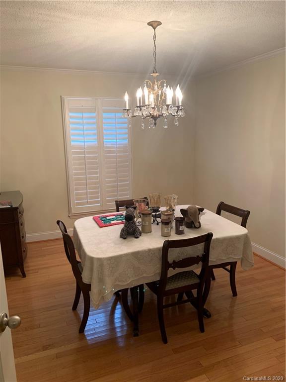 1150 Miles Road Dallas, NC 28034 - Photo 6 of 14 a view of a dining room with furniture and chandelier