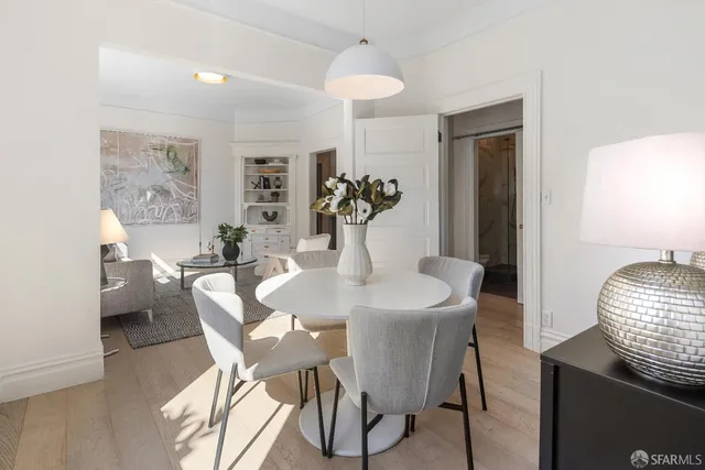 a dining room with furniture and window