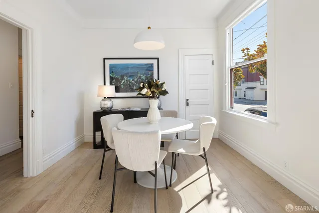 a dining room with furniture and window