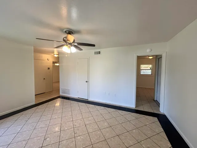 a view of an empty room and window