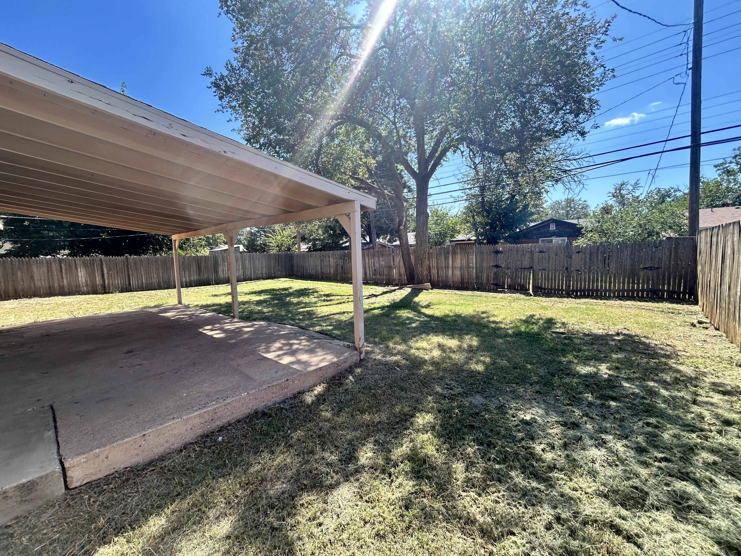 2807 60th Street Lubbock, TX 79413 - Photo 14 of 15 a view of a backyard with swimming pool