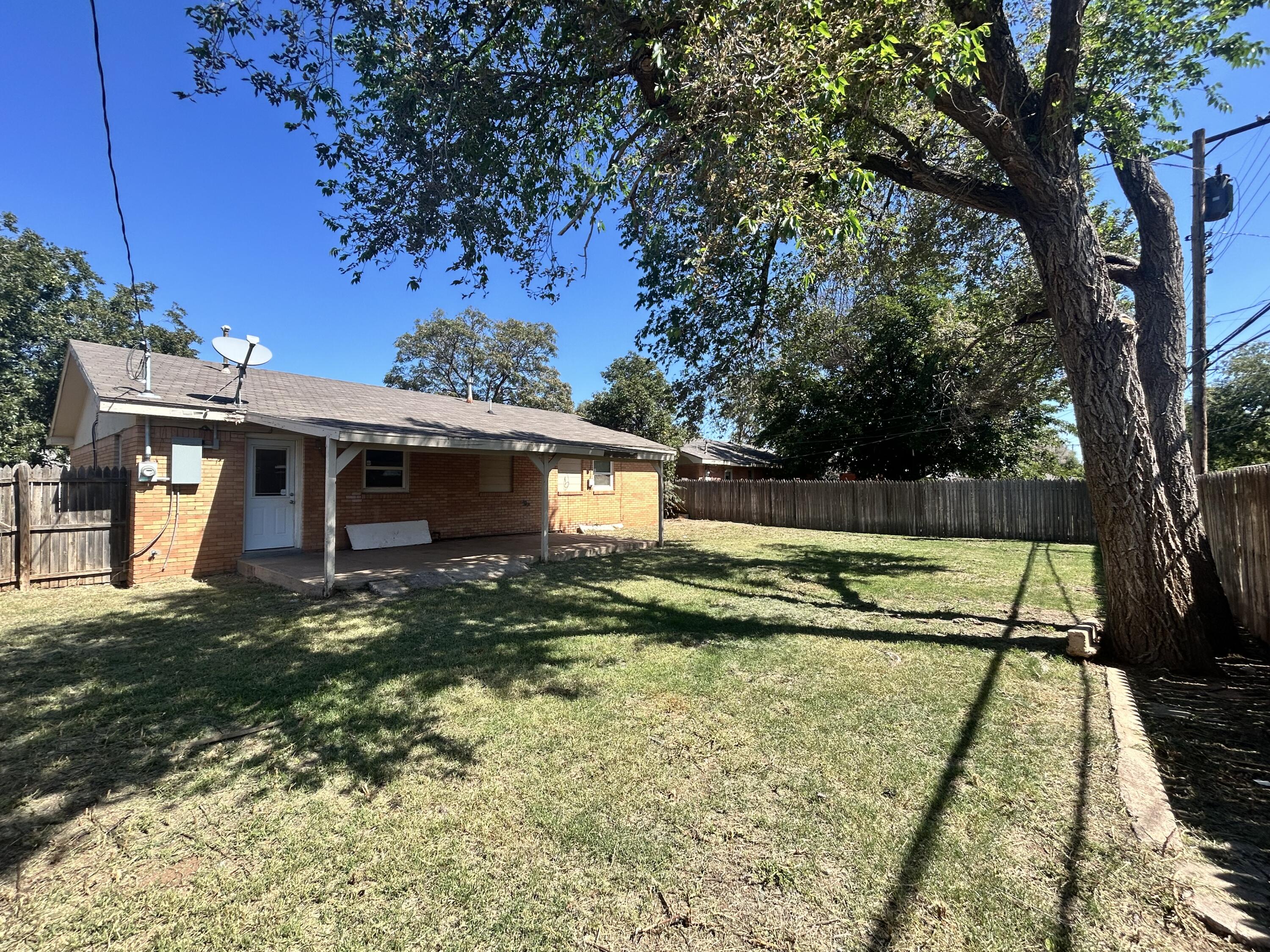 2807 60th Street Lubbock, TX 79413 - Photo 15 of 15 a view of a house with a yard