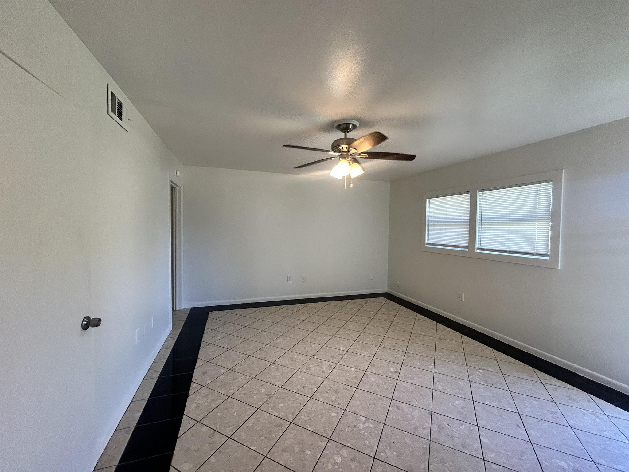 2807 60th Street Lubbock, TX 79413 - Photo 3 of 15 a view of an empty room with a window