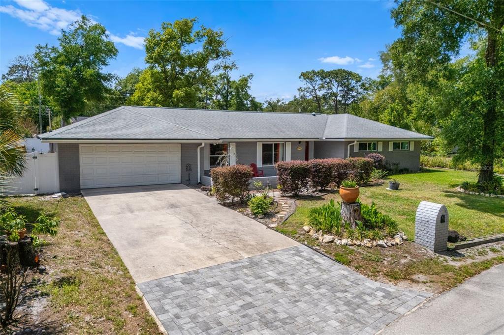 1702 Elaine Avenue Altamonte Springs, FL 32701 - Photo 1 of 39 a front view of a house with garden