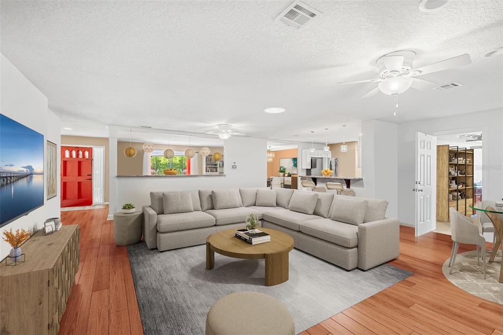 1702 Elaine Avenue Altamonte Springs, FL 32701 - Photo 13 of 39 a living room with furniture and a flat screen tv