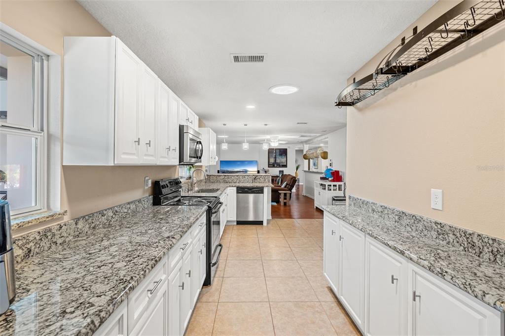 1702 Elaine Avenue Altamonte Springs, FL 32701 - Photo 18 of 39 a large kitchen with cabinets