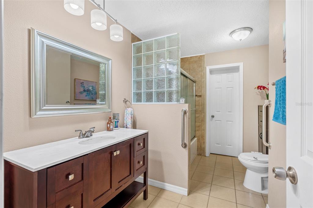 1702 Elaine Avenue Altamonte Springs, FL 32701 - Photo 20 of 39 a bathroom with a double vanity sink mirror and toilet