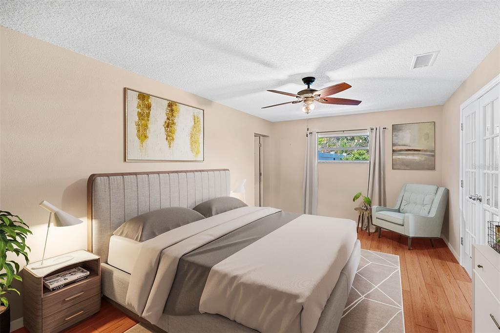 1702 Elaine Avenue Altamonte Springs, FL 32701 - Photo 21 of 39 a bed room with a bed and a chandelier