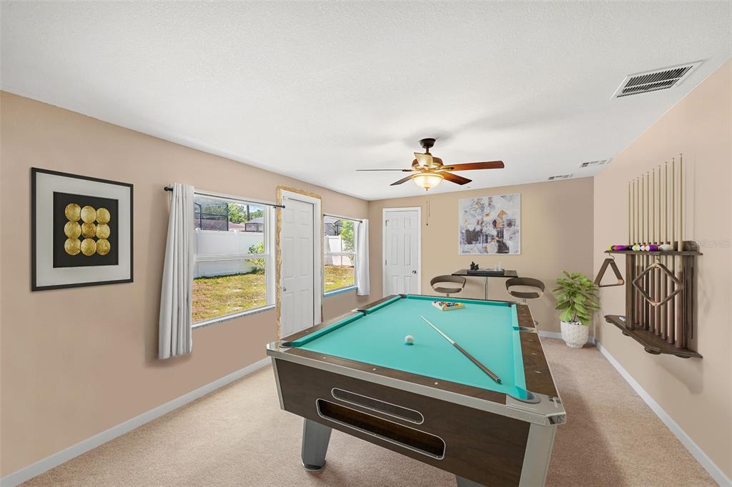 1702 Elaine Avenue Altamonte Springs, FL 32701 - Photo 28 of 39 a room with furniture and a table