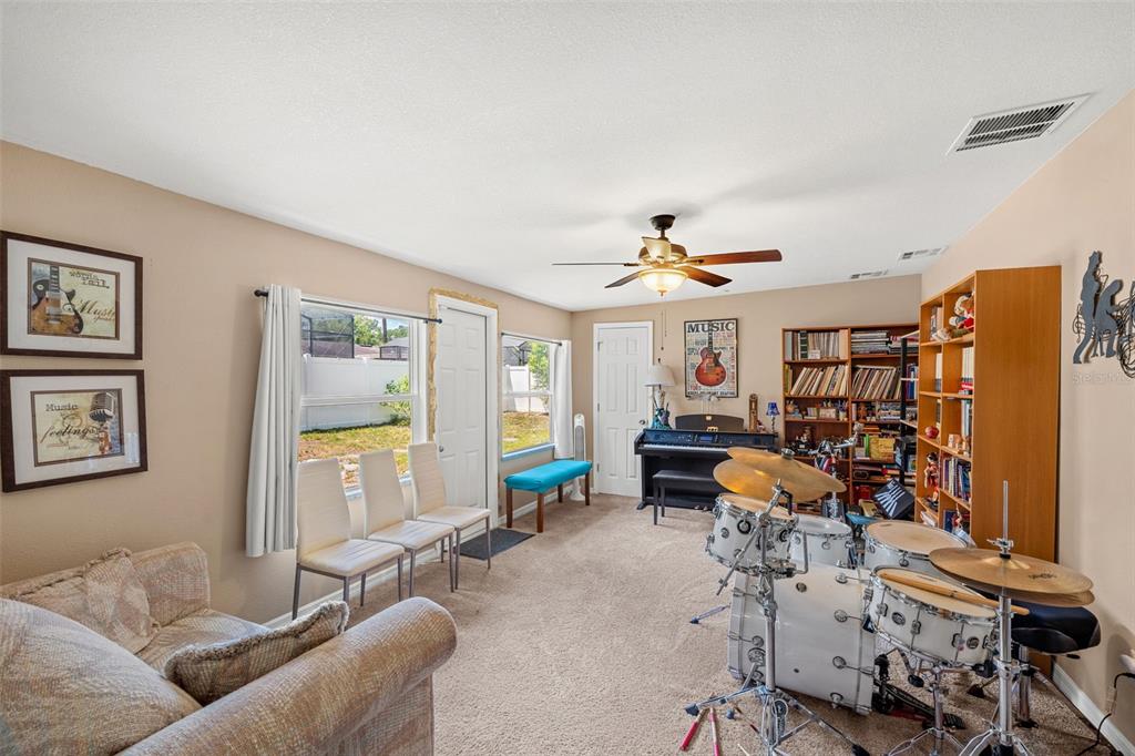 1702 Elaine Avenue Altamonte Springs, FL 32701 - Photo 29 of 39 a living room with furniture and a large window