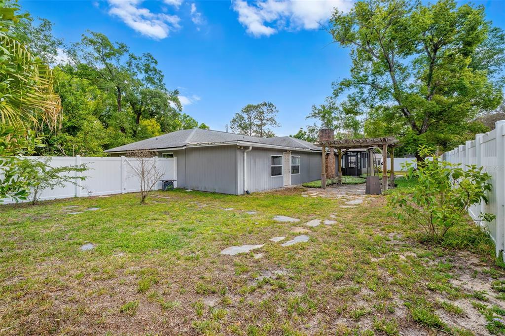 1702 Elaine Avenue Altamonte Springs, FL 32701 - Photo 34 of 39 a front view of a house with a garden