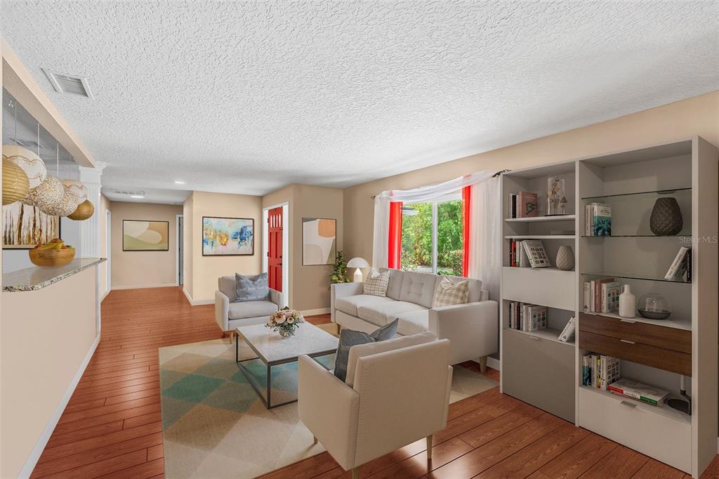 1702 Elaine Avenue Altamonte Springs, FL 32701 - Photo 4 of 39 a living room with furniture and a wooden floor