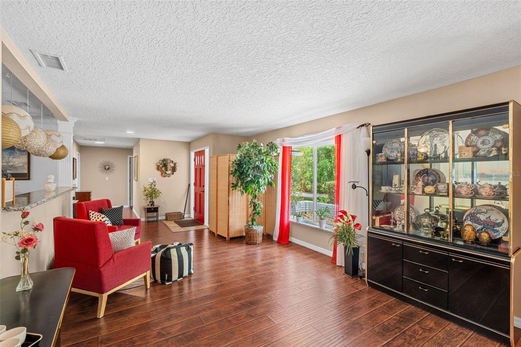 1702 Elaine Avenue Altamonte Springs, FL 32701 - Photo 5 of 39 a living room with furniture and a large window