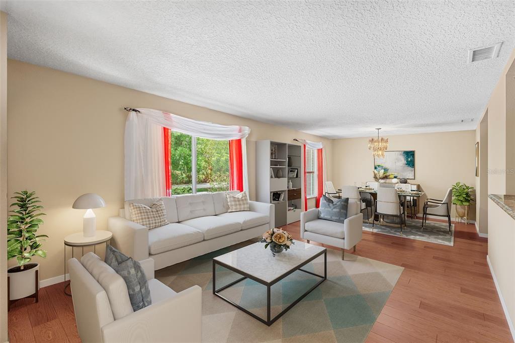 1702 Elaine Avenue Altamonte Springs, FL 32701 - Photo 6 of 39 a living room with furniture and a large window