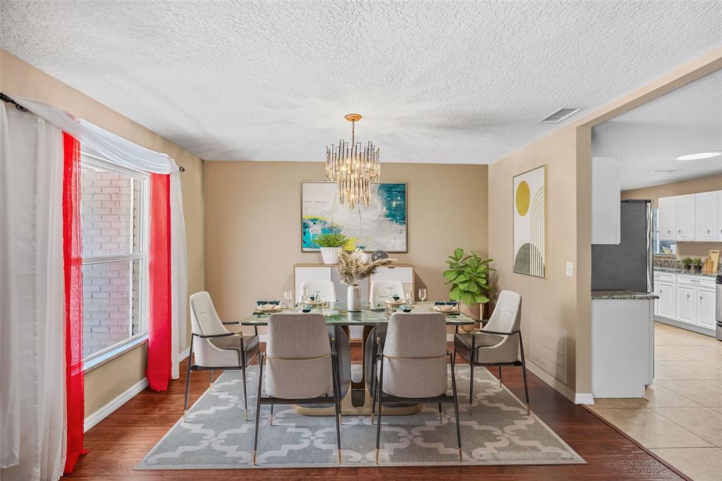 1702 Elaine Avenue Altamonte Springs, FL 32701 - Photo 7 of 39 a view of a dining room with furniture and window