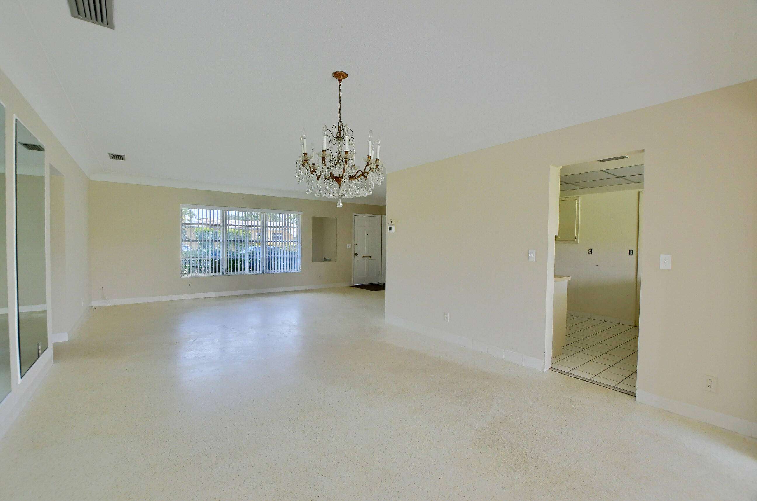 1099 Southwest 13th Place Boca Raton, FL 33486 - Photo 12 of 45 wooden floor in an empty room with a window