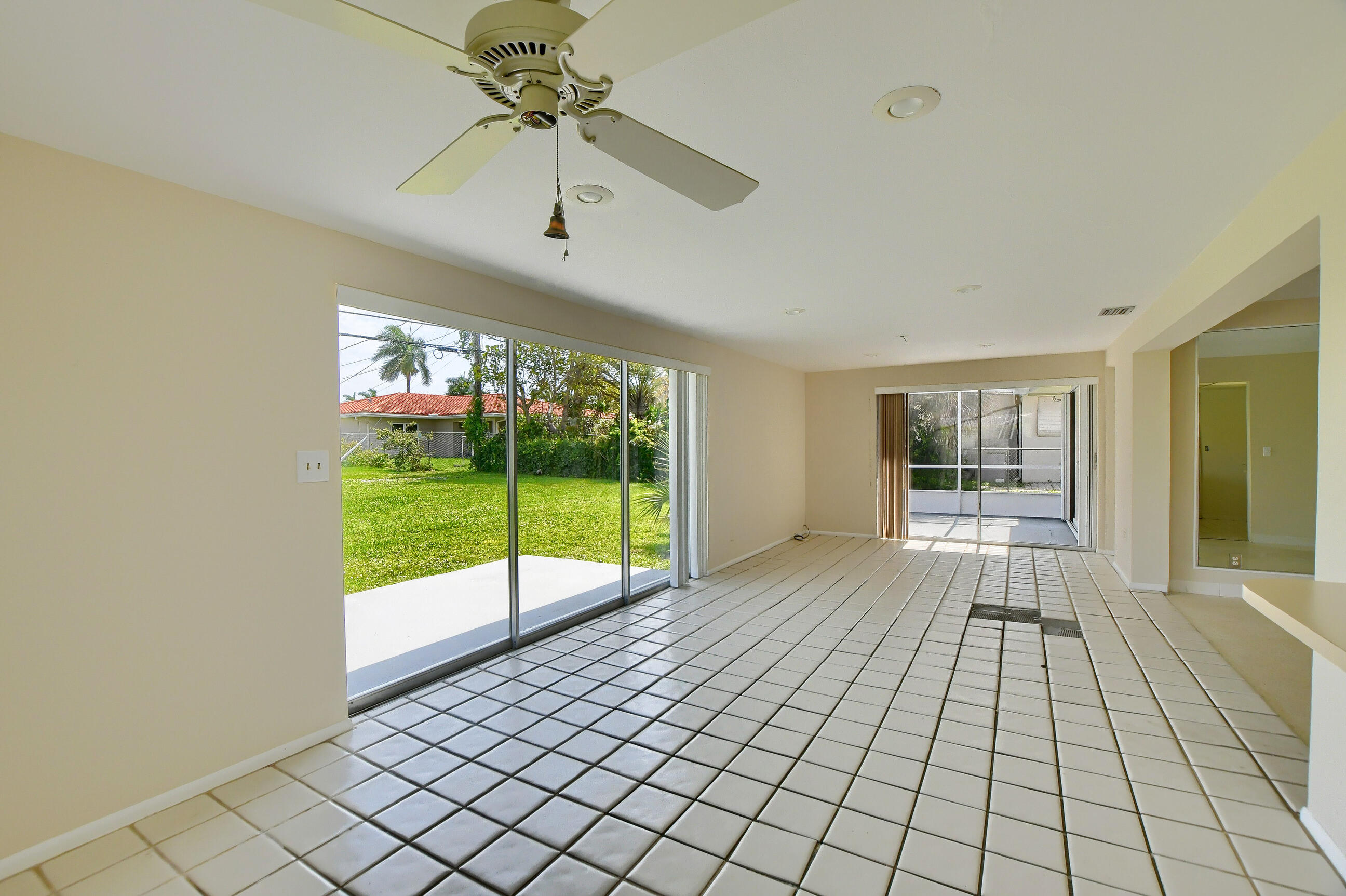1099 Southwest 13th Place Boca Raton, FL 33486 - Photo 13 of 45 a view of an empty room with a window