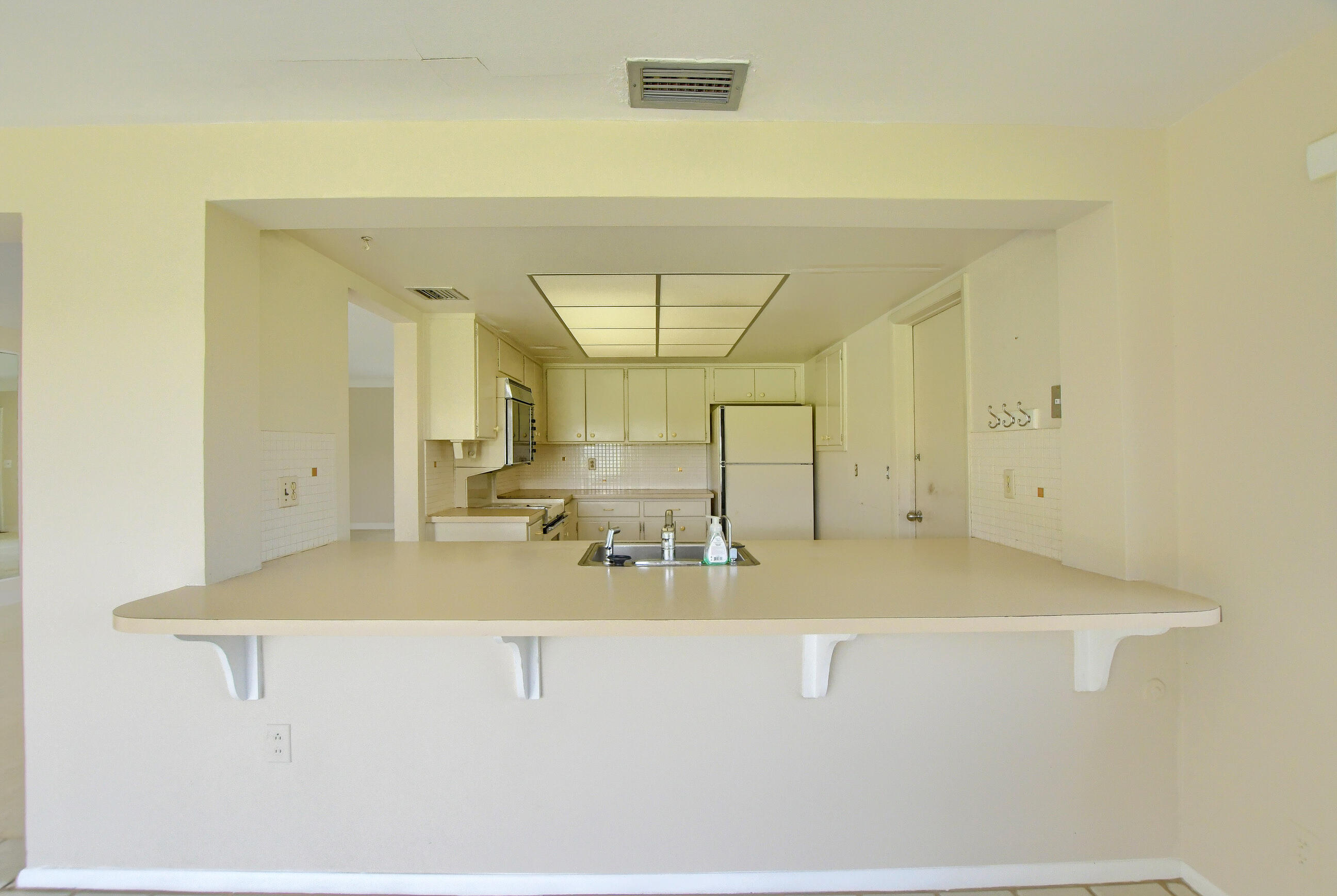 1099 Southwest 13th Place Boca Raton, FL 33486 - Photo 15 of 45 a view of a living room with a sink