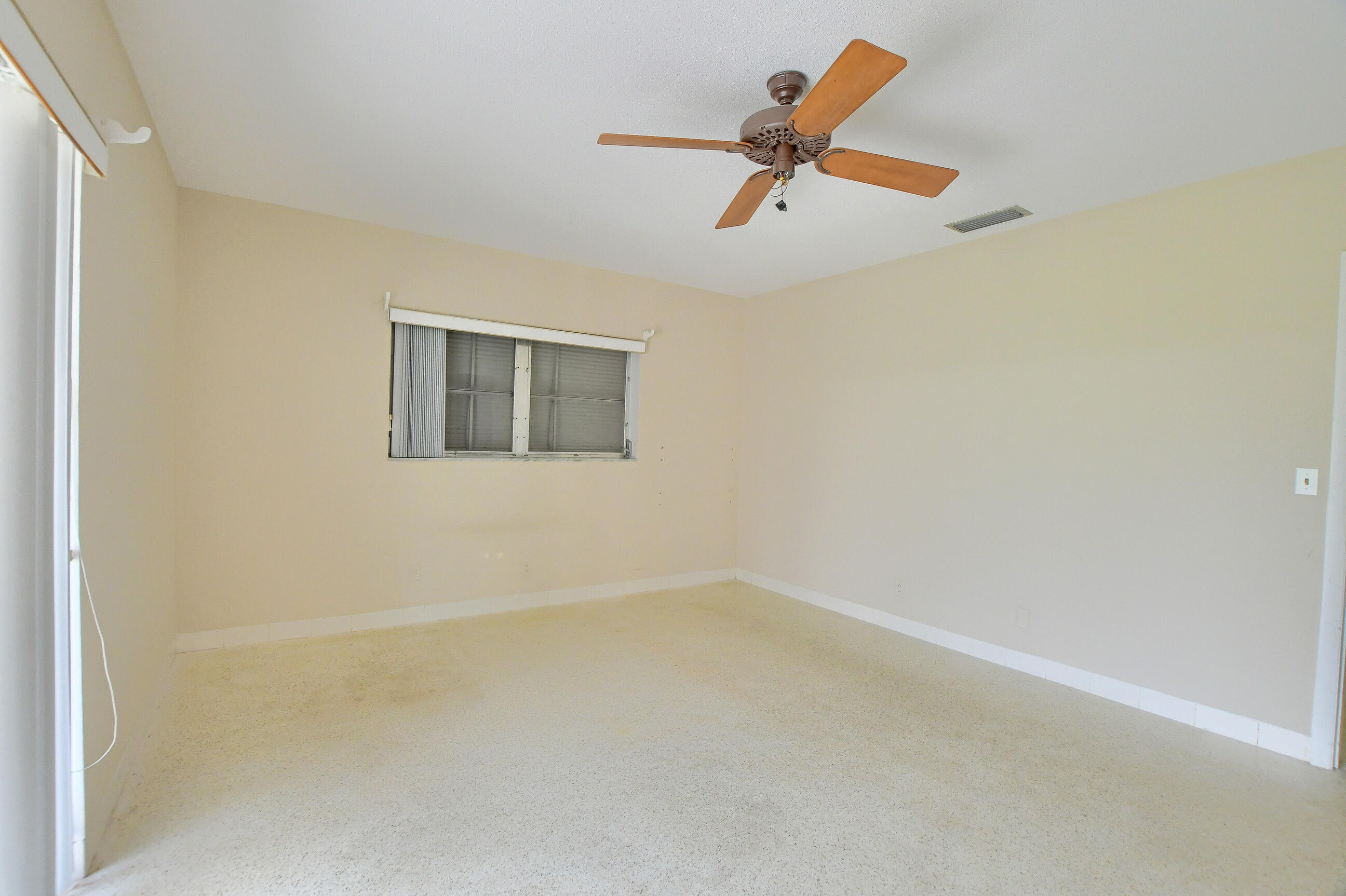 1099 Southwest 13th Place Boca Raton, FL 33486 - Photo 21 of 45 an empty room with a window