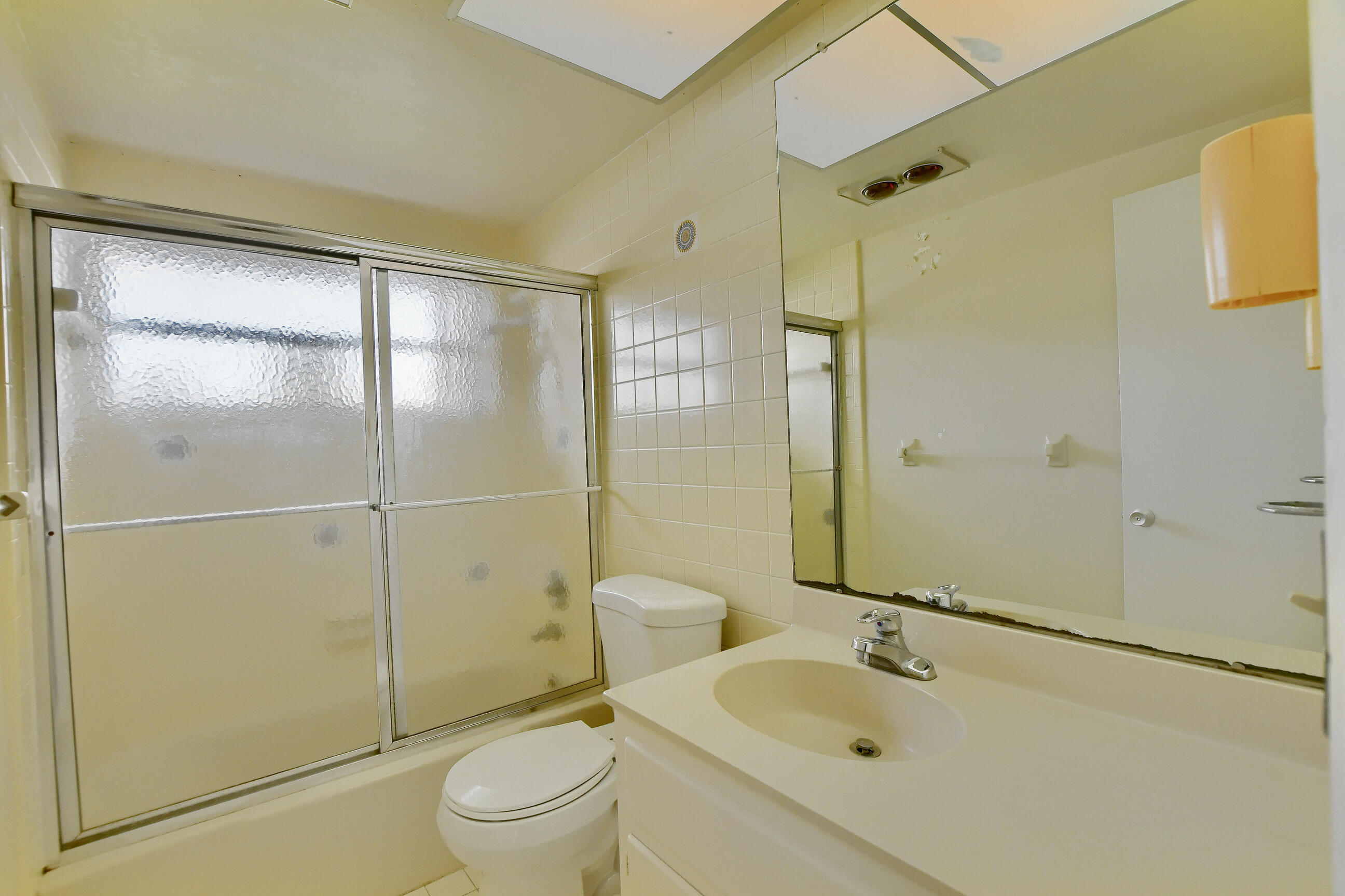 1099 Southwest 13th Place Boca Raton, FL 33486 - Photo 26 of 45 a bathroom with a sink toilet and shower