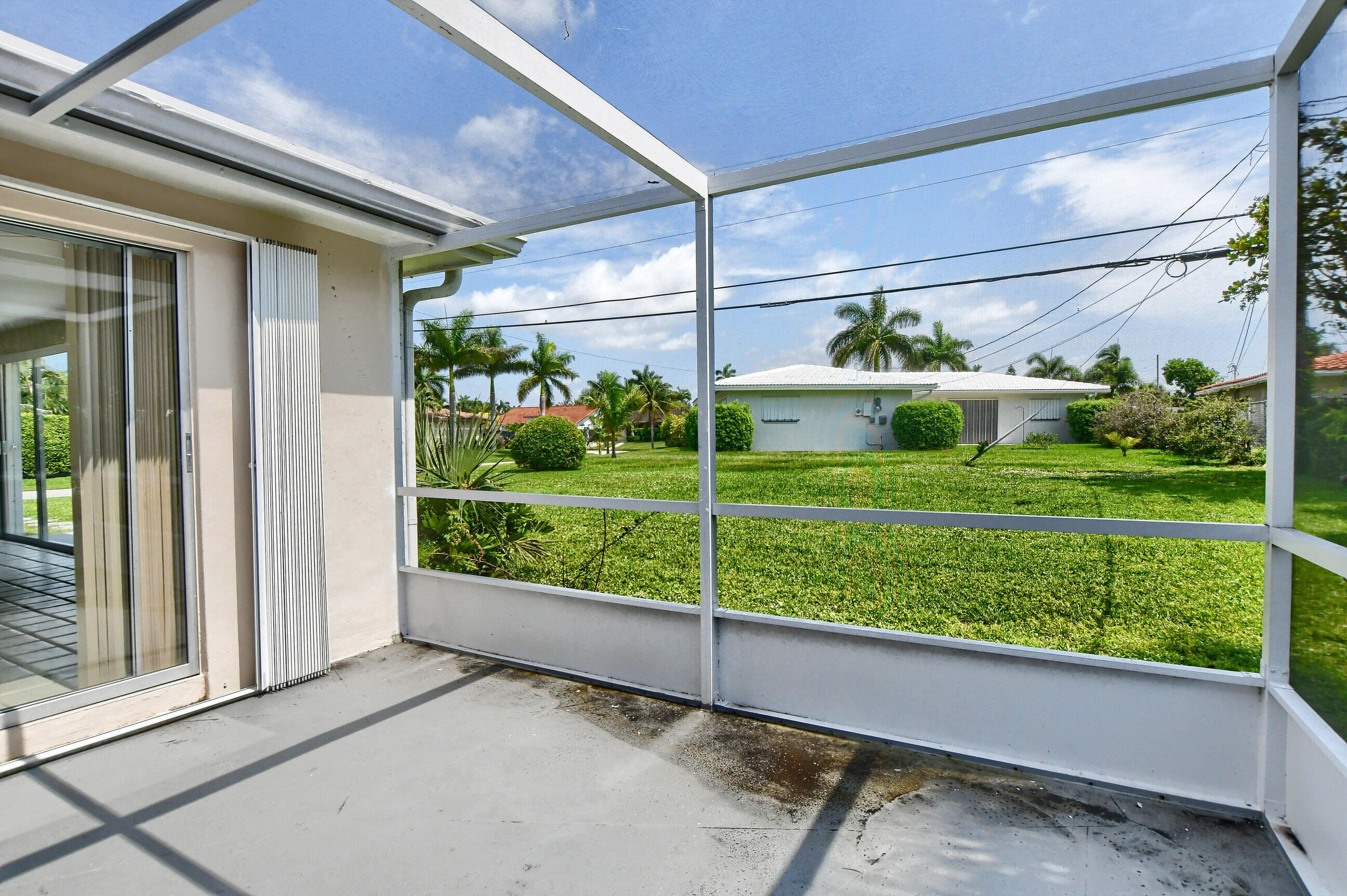 1099 Southwest 13th Place Boca Raton, FL 33486 - Photo 28 of 45 a view of a porch with a yard