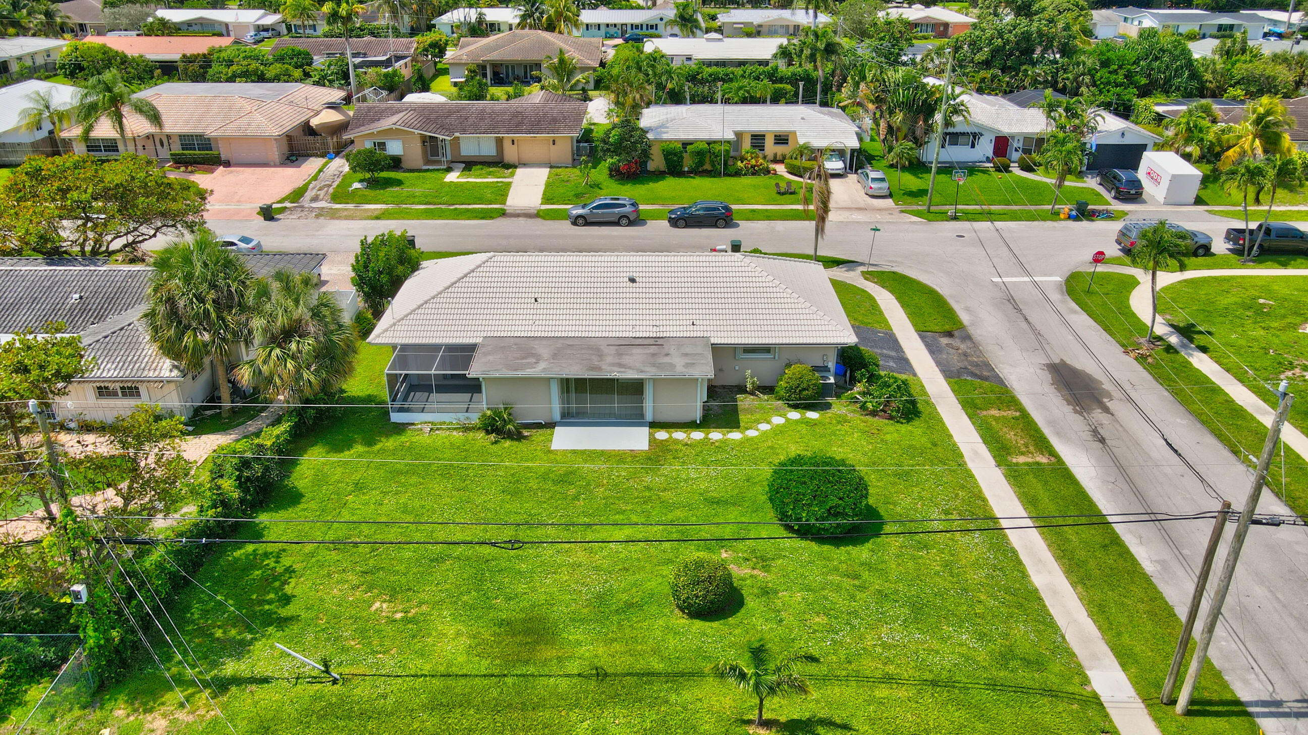 1099 Southwest 13th Place Boca Raton, FL 33486 - Photo 3 of 45 an aerial view of residential houses with outdoor space and a swimming pool