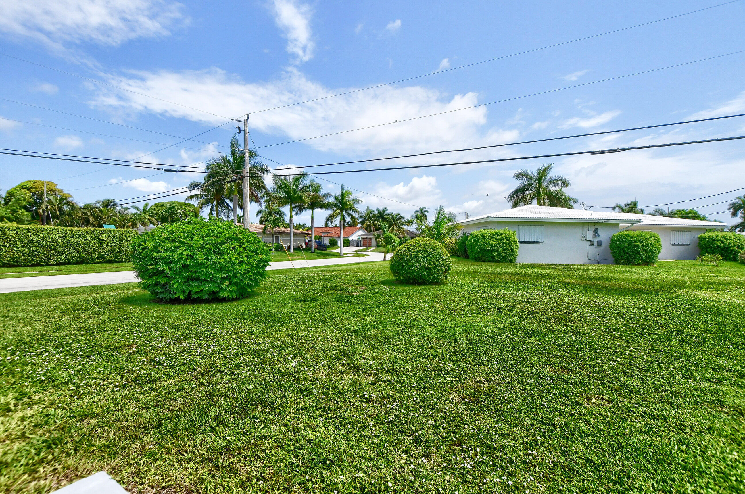 1099 Southwest 13th Place Boca Raton, FL 33486 - Photo 43 of 45 a view of a garden in front of the house