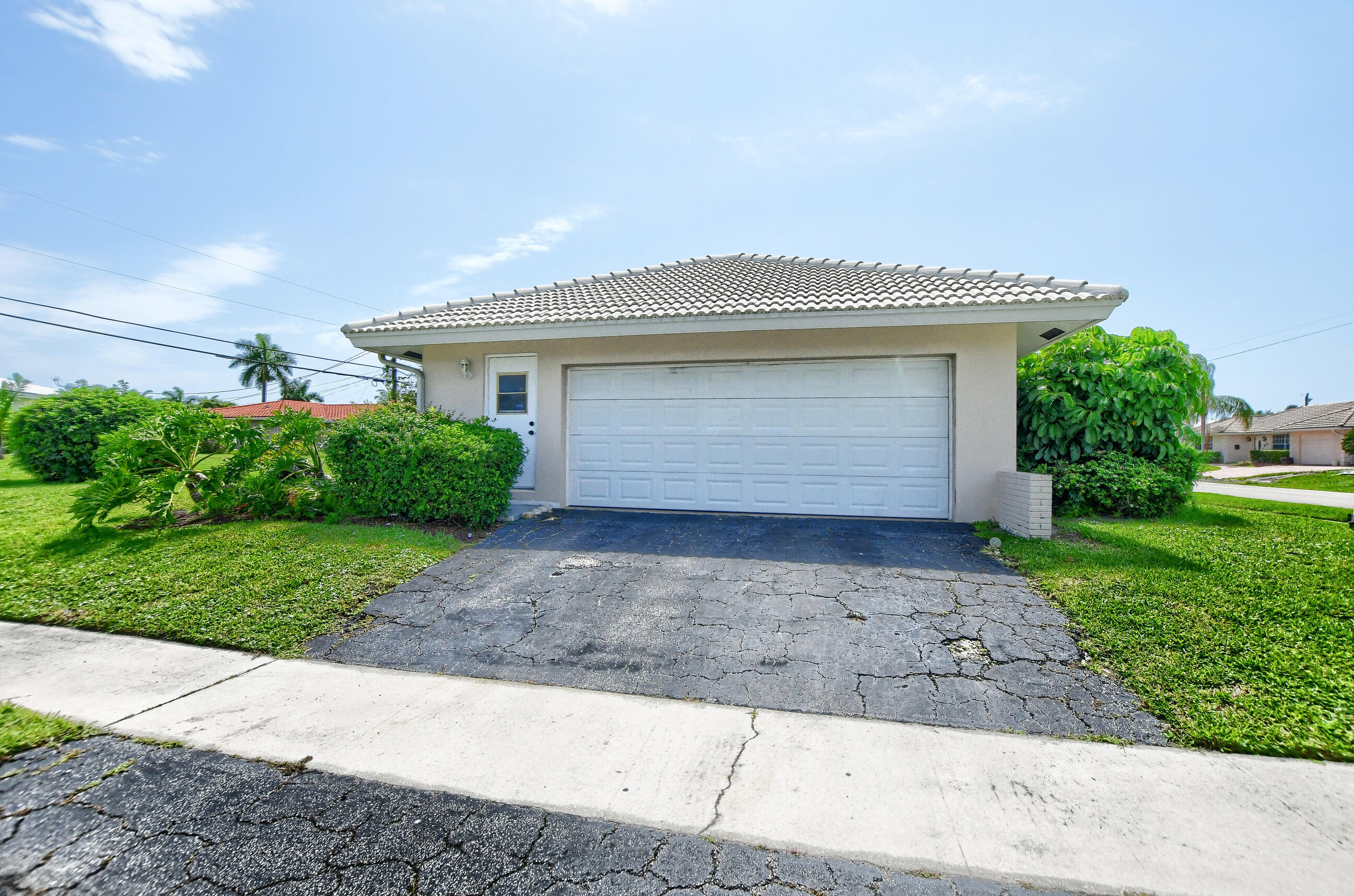 1099 Southwest 13th Place Boca Raton, FL 33486 - Photo 45 of 45 a front view of house with a garden