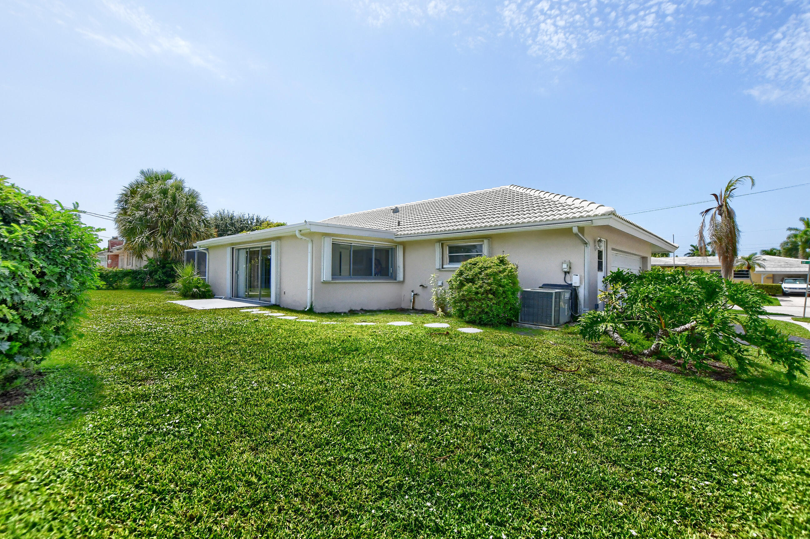 1099 Southwest 13th Place Boca Raton, FL 33486 - Photo 5 of 45 a view of a house with a backyard
