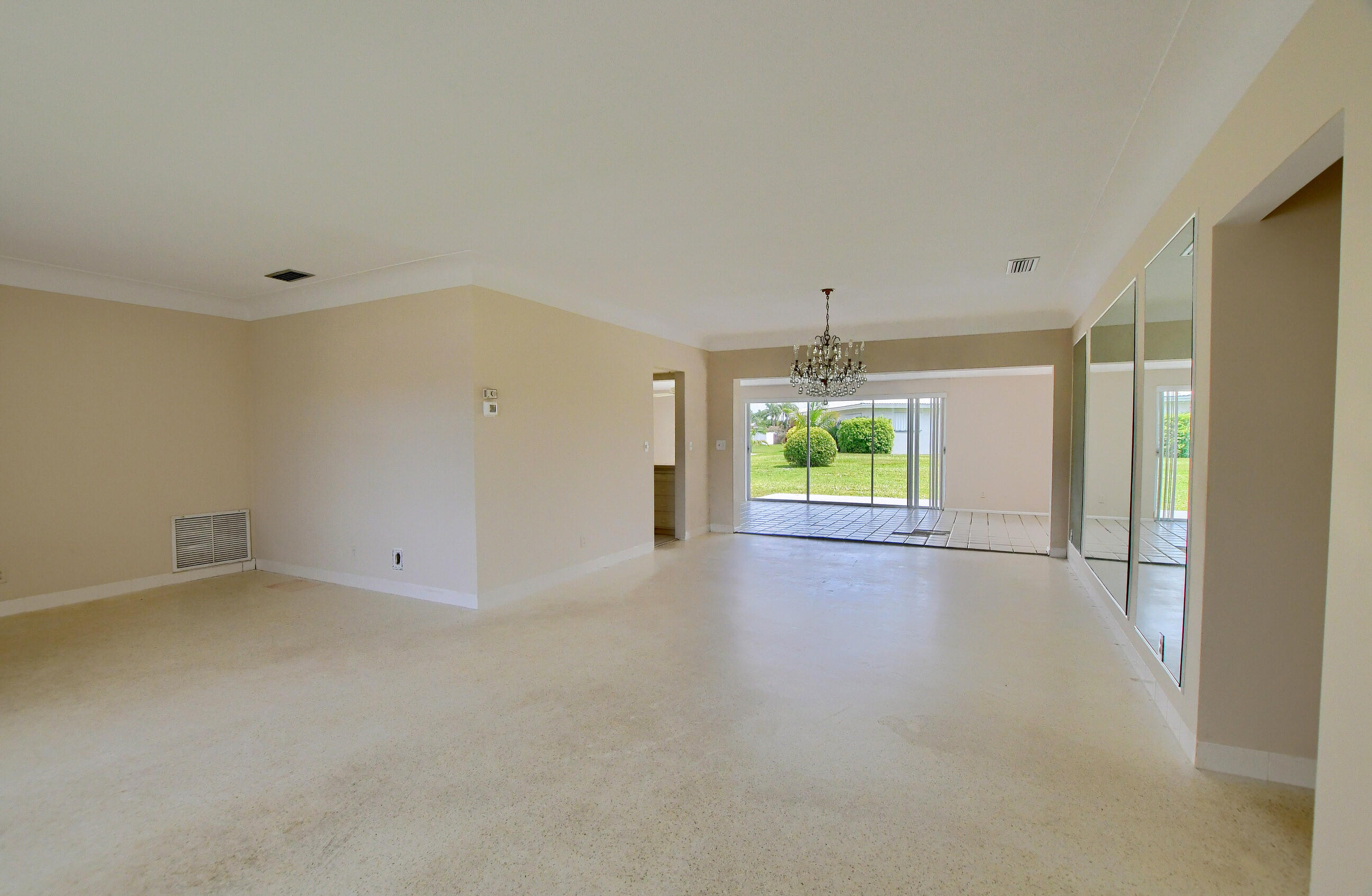 1099 Southwest 13th Place Boca Raton, FL 33486 - Photo 10 of 45 a view of an empty room with a window