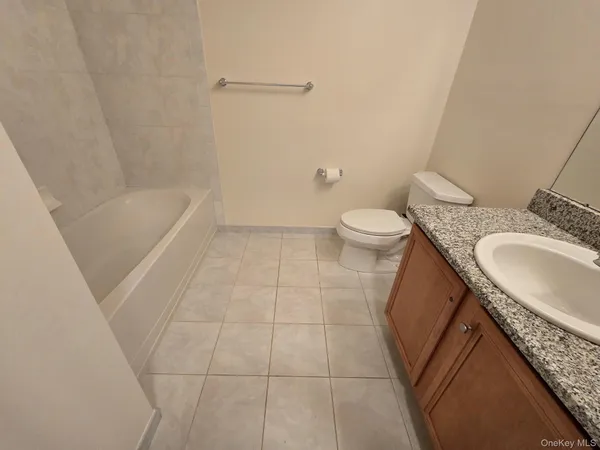 a view of hallway with stainless steel appliances