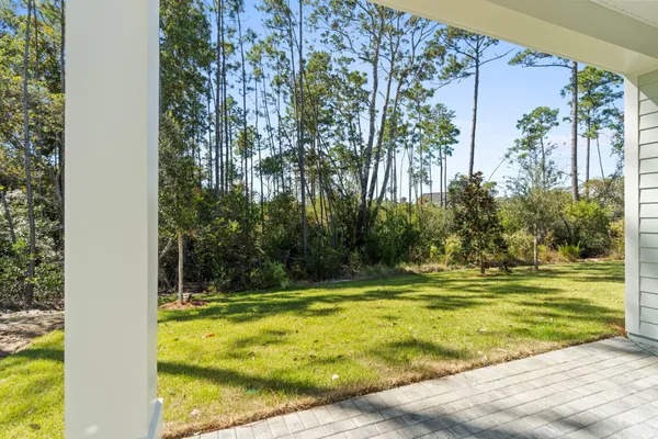 a view of a swimming pool with an outdoor space and seating area